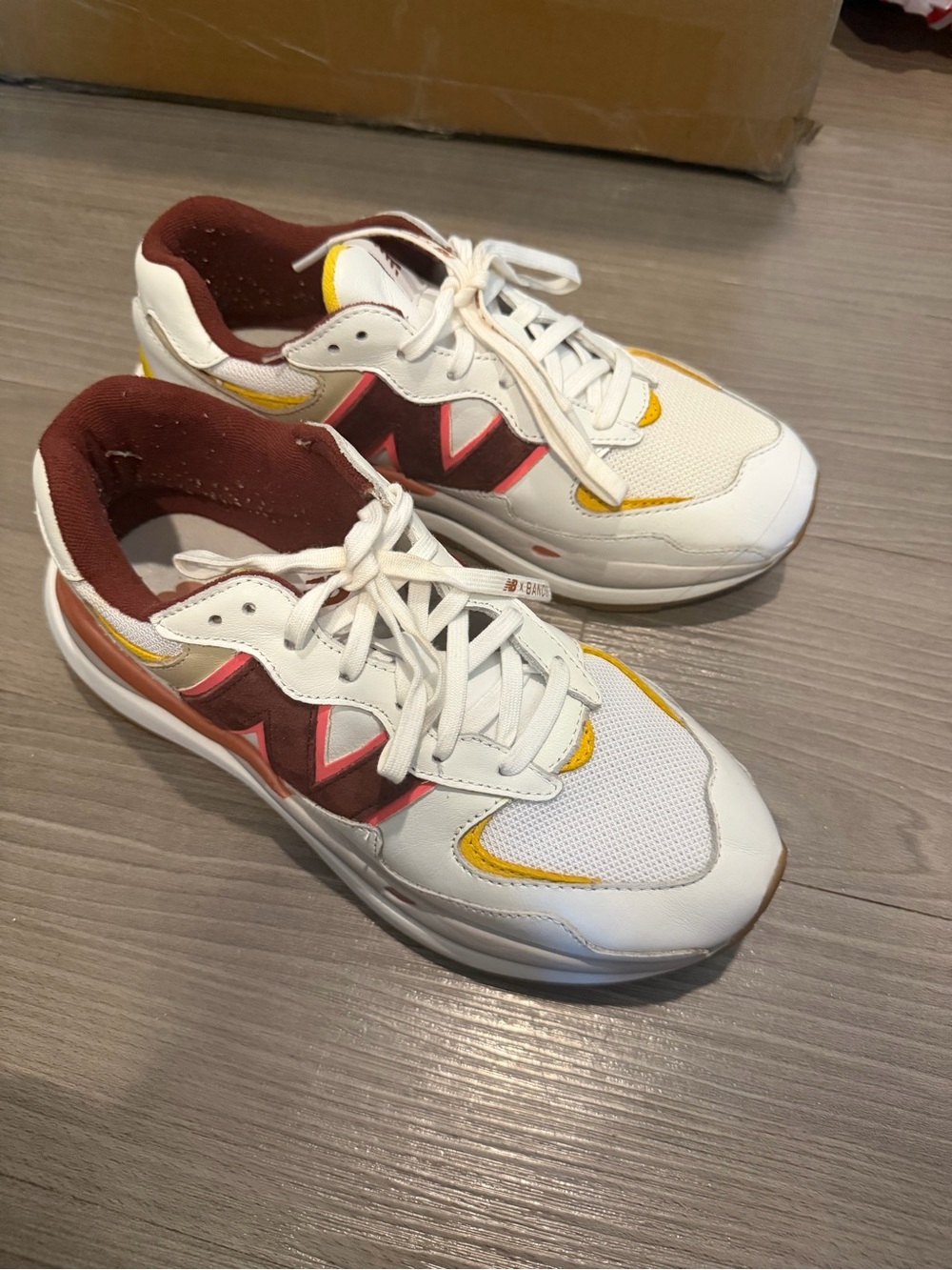 New Balance Women’s White Sneakers with Maroon and Yellow Accents